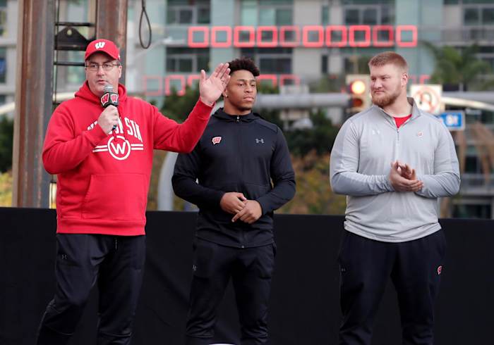 Paul Chryst speaking before the Rose Bowl with Jonathan Taylor and Tyler Biadasz.